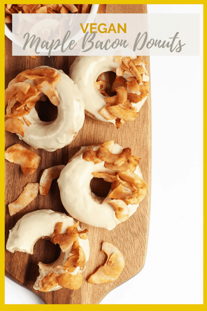 Vegan Maple Bacon Doughnuts! These amazing doughnuts are lightly spiced and baked to perfection. Finished them off with a sweet maple glaze and crispy coconut bacon for a delicious morning pastry.