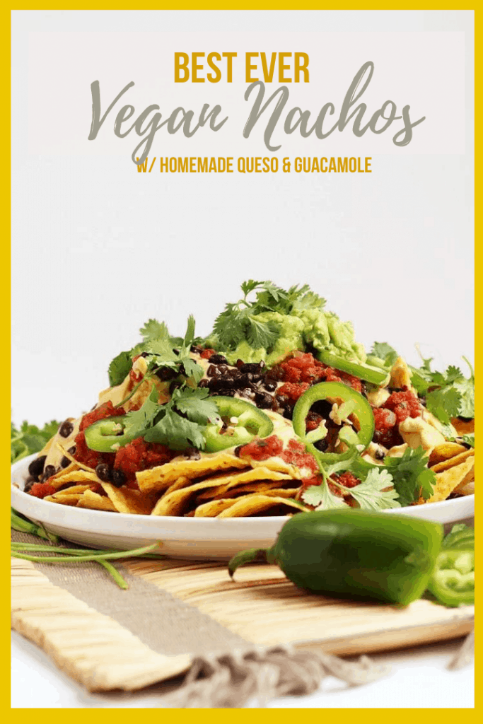 These Homemade Vegan Nachos are made with easy guacamole, vegan queso, and all the fixings for a delicious gluten-free party dish. You won't be able to get enough!