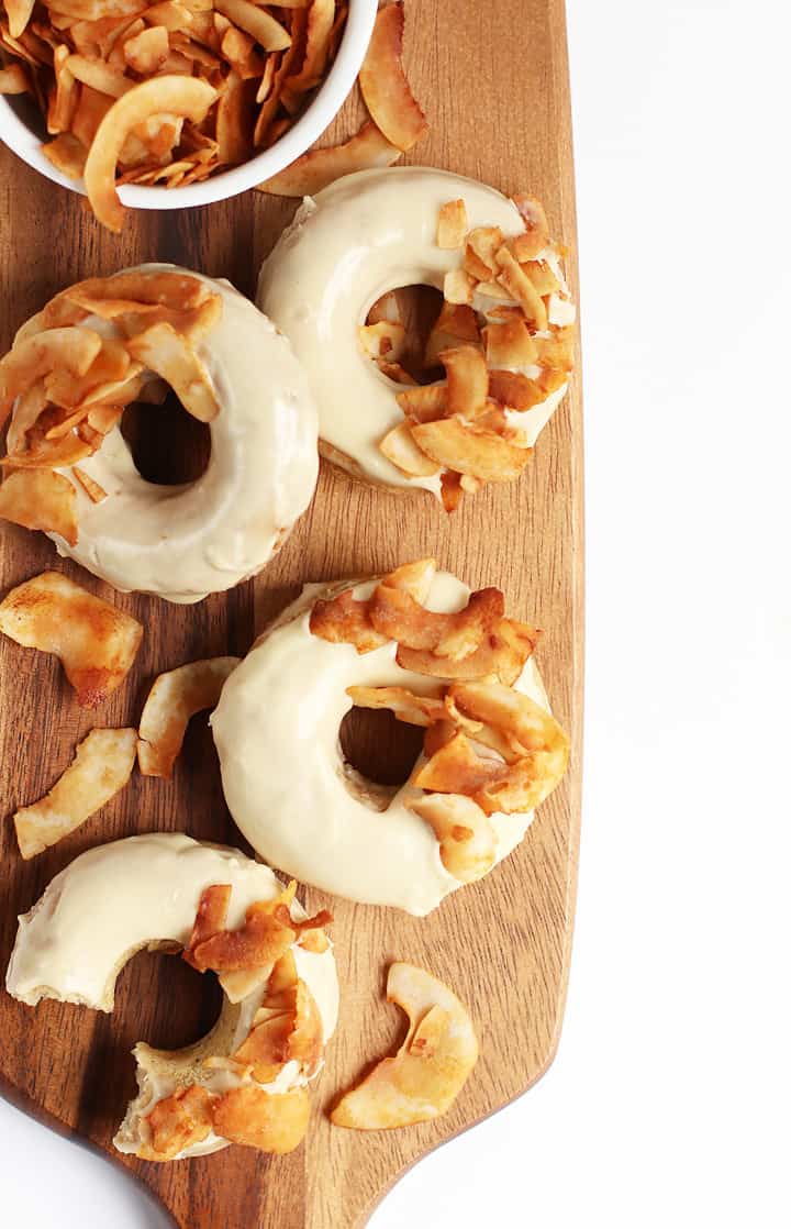 Finished donuts on a wooden platter