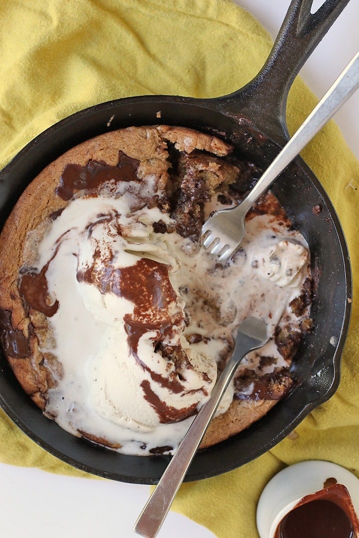 Finished dessert in a skillet with two forks