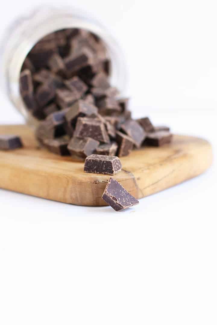 Chocolate chips spilling out of a small mason jar. 