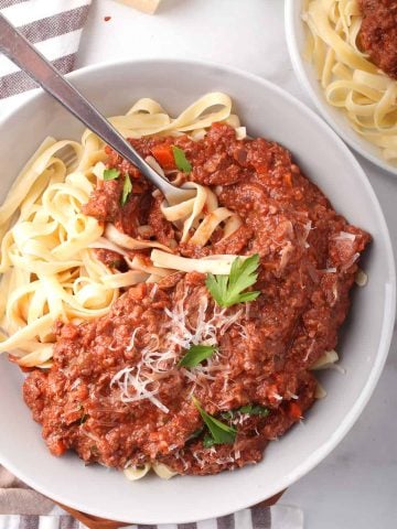 Finished bowl of vegan pasta with a fork