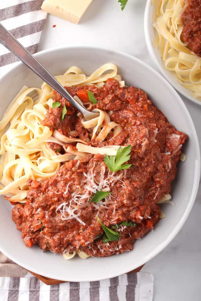 Finished bowl of vegan pasta with a fork