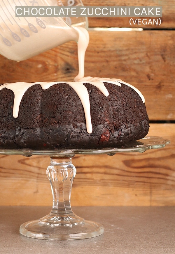 A rich and moist vegan Chocolate Zucchini Cake with cinnamon glaze; the perfect dessert to celebrate the beginning of fall. Pair it with a glass of red wine for a wonderful evening of decadence. #chocolate #zucchini #cake #baking #fallrecipes #hazelnuts #vegan #veganbaking #sponsored #mydarlingvegan