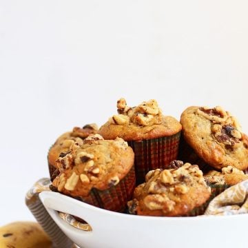 Finished muffins stacked inside a white bowl