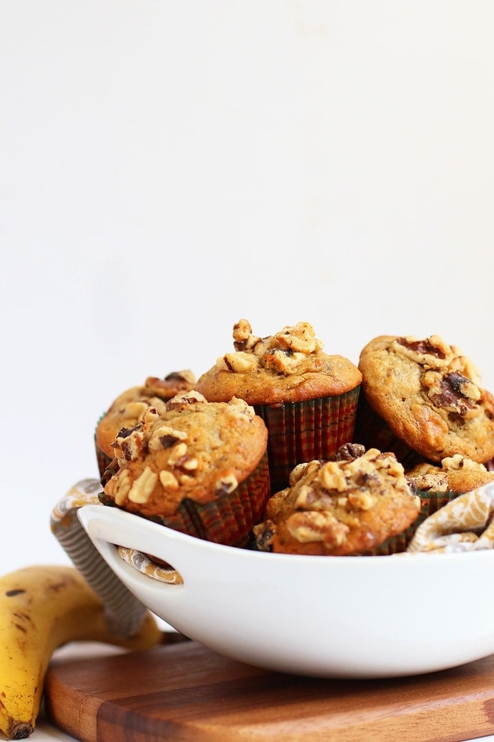 Finished muffins stacked inside a white bowl