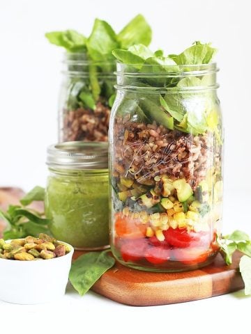 Finished salads in two large Mason jars