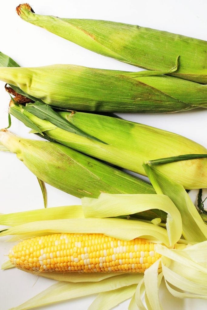 5 Corn on the cob on a white background