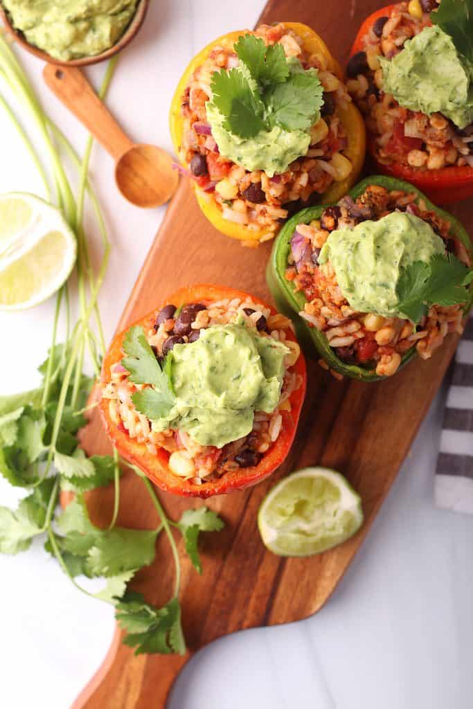 Stuffed bell peppers on a wooden platter