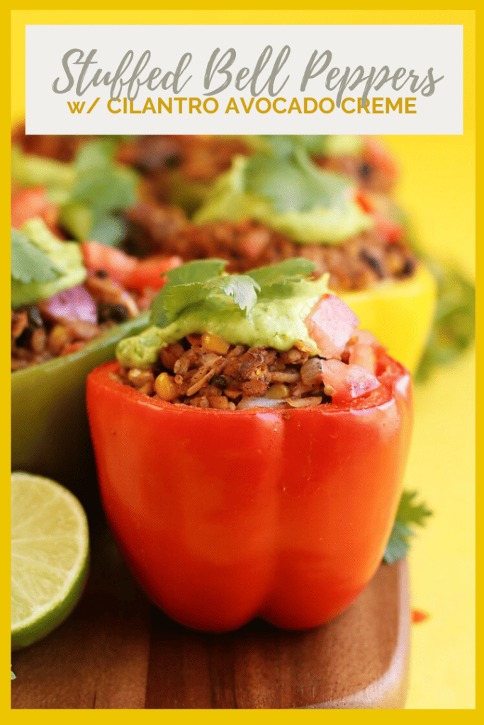 These Mexican-Style Vegan Stuffed Peppers are perfect! They are filled with tempeh, corn, beans, and spices and topped with a homemade avocado cream for a delicious and healthy vegan and gluten-free meal.