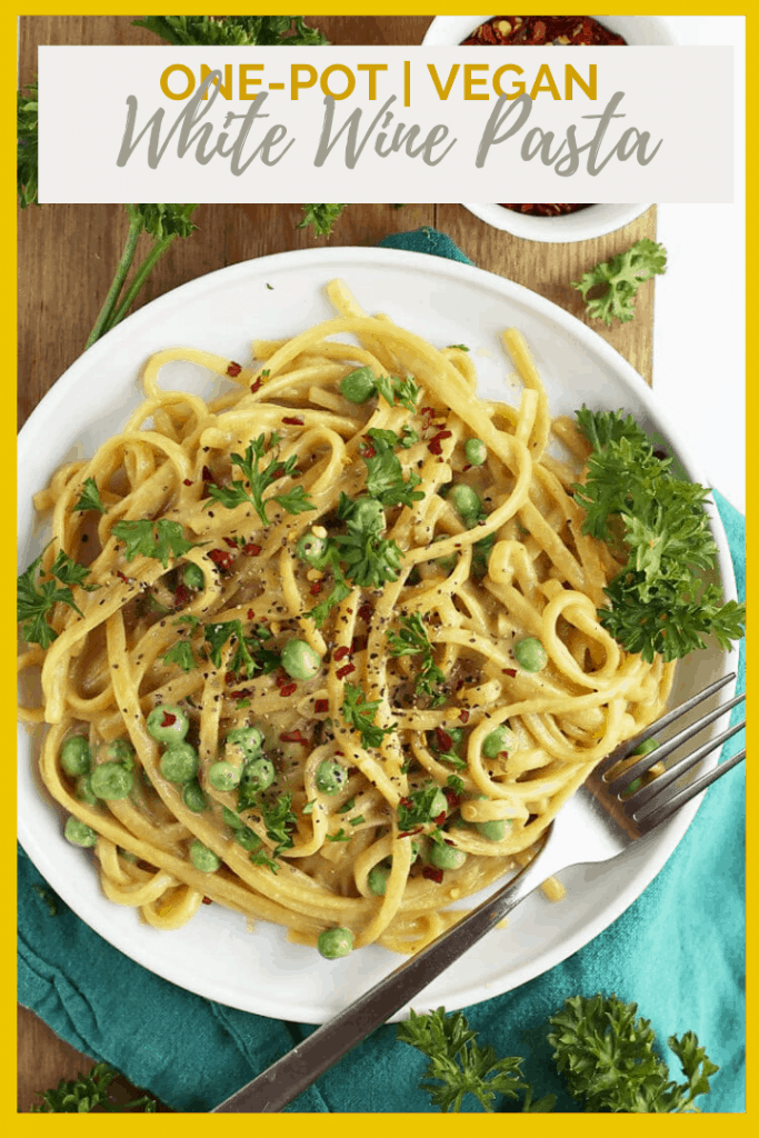 Make dinner quick and easy with this delicious 30 minute, one-pot, vegan Garlic White Wine Pasta. It is topped with fresh parsley, peas, and red pepper flakes for a complete meal.