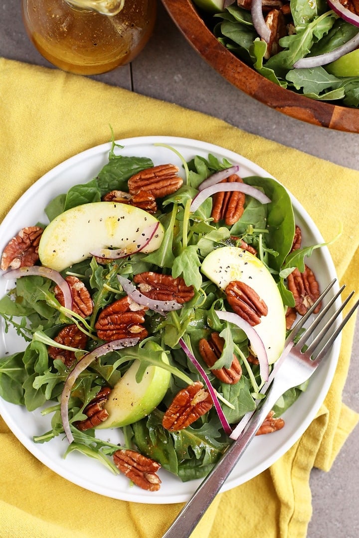 Finished salad on a white plate with a fork