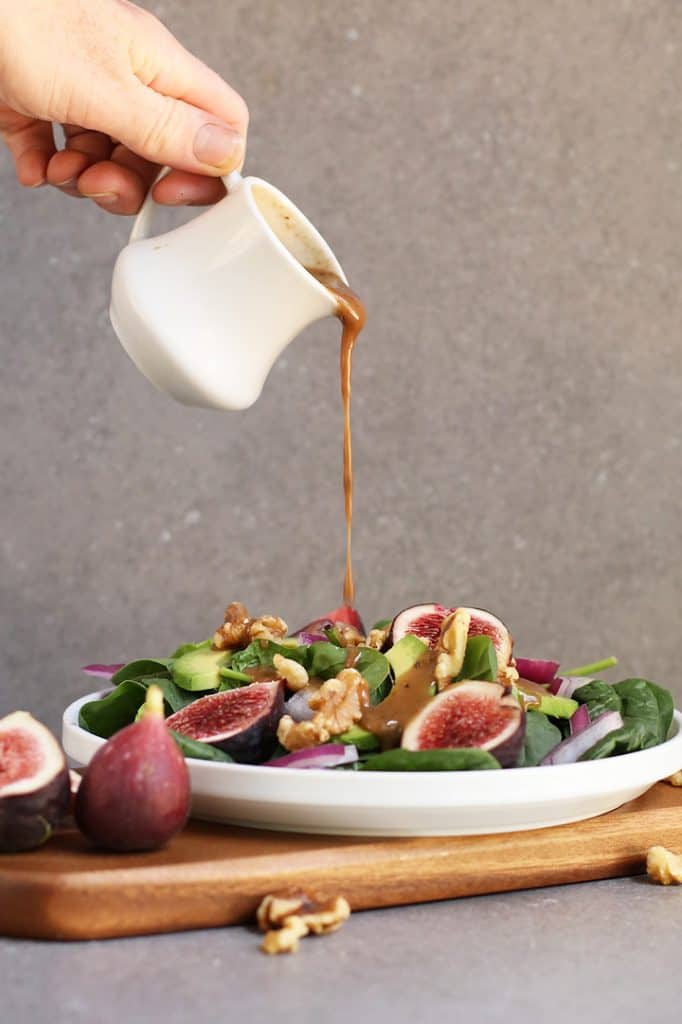 Balsamic Vinaigrette poured over finished salad 