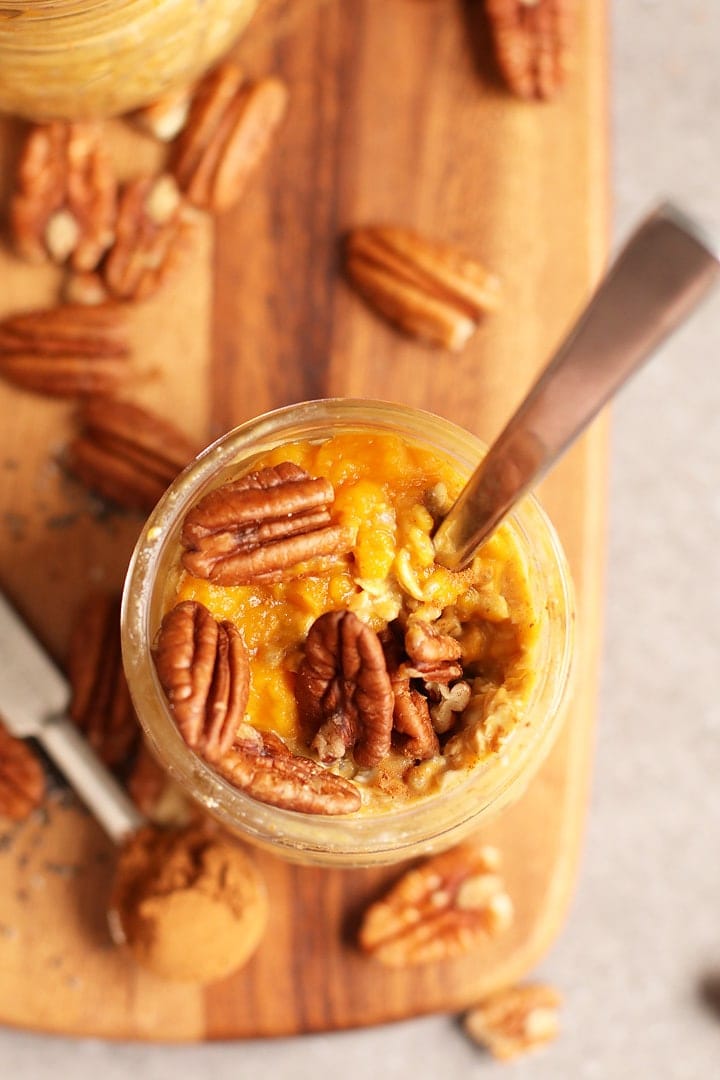 Pumpkin Pie Overnight Oats in a mason jar with a spoon