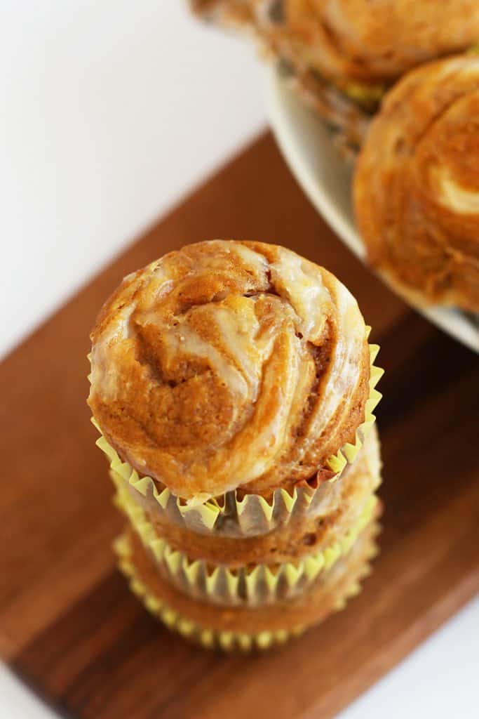 Stack of finished muffins on a wooden platter