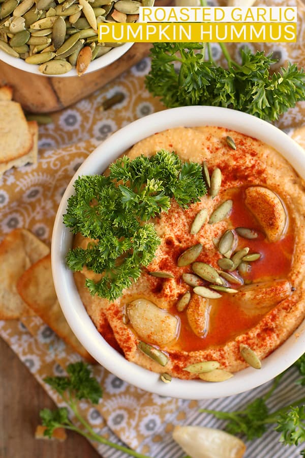 Make your hummus at home with this seasonal smoky Roasted Garlic Pumpkin Hummus. Serve this healthy and delicious gluten-free snack with carrots, crackers, and pita chips. #vegan #hummus #snacks #appetizers #pumpkin #fallrecipes #glutenfree #mydarlingvegan