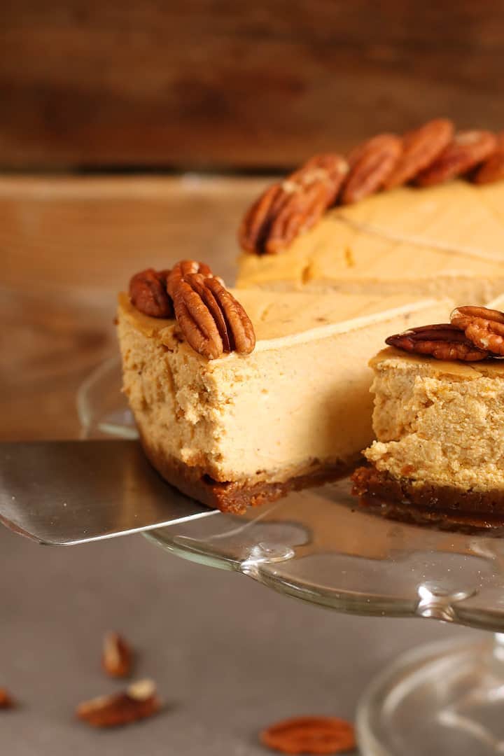 Close up of vegan Pumpkin Cheesecake with gingersnap crust. 