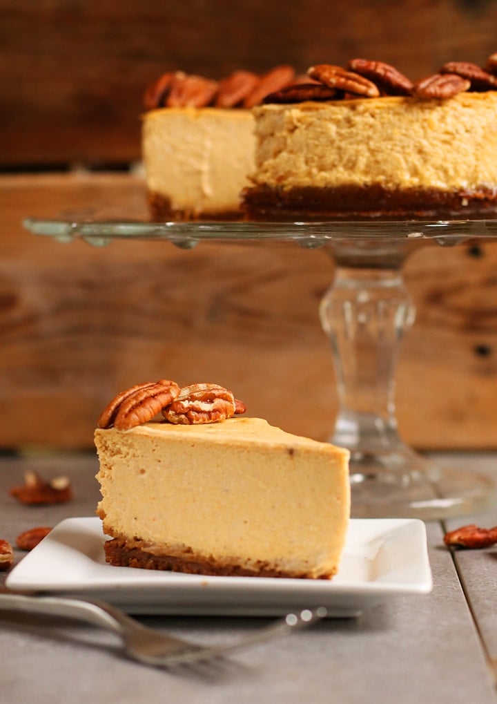 Slice of finished cheesecake on a white plate