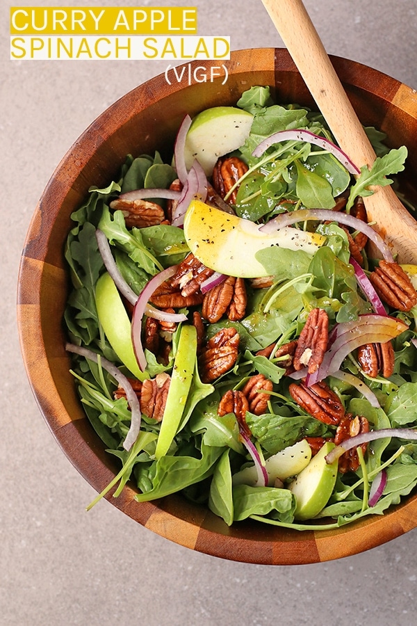 This Curry Apple Spinach Salad is the perfect fall salad. It is a mixture of spinach and arugula tossed with apples, pecans, and curry vinaigrette dressing.