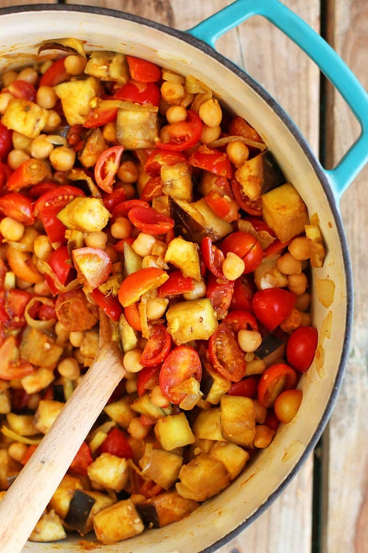 Chickpeas, tomatoes, and eggplant stewed together in a soup pot