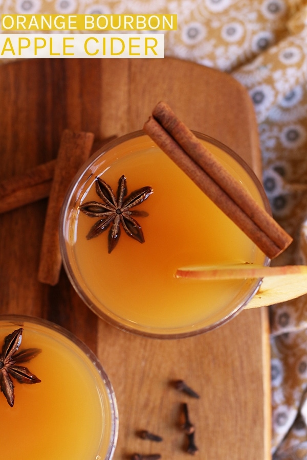 Warm up on these cold autumn nights with a Orange Bourbon Apple Cider spiced with whole spices and fresh apples for a delicious evening beverage. #vegan #bourbon #fallrecipes #cocktails #fallcocktails #mydarlingvegan