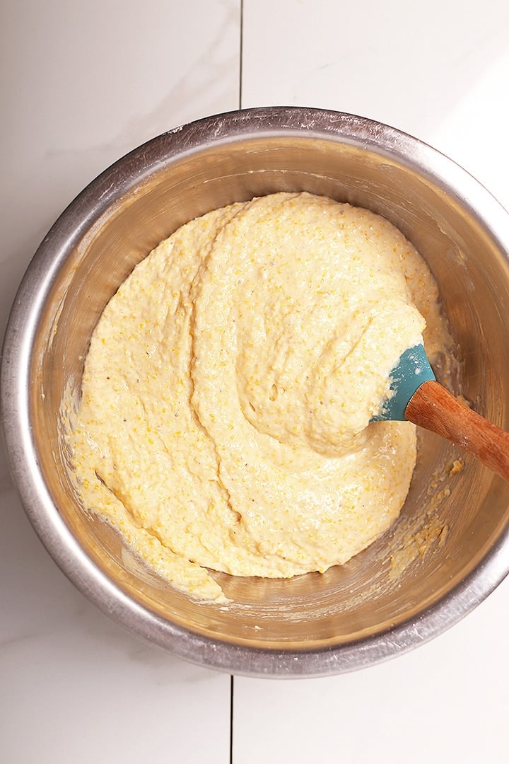 Cornbread batter in a metal bowl