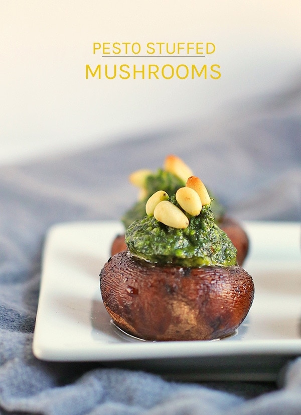 These vegan Pesto-Stuffed Mushrooms make the perfect appetizer for your holiday parties. Baby portobellos stuffed with fresh arugula basil. #vegan #vegetarian #portobello #pesto #appetizers #holidays #christmasrecipes #veganchristmas #mydarlingvegan