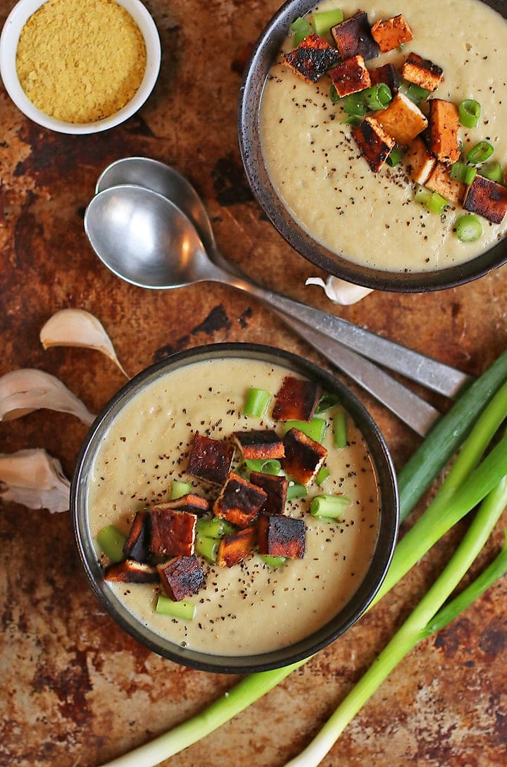Two bowls of Cream of Cauliflower Soup