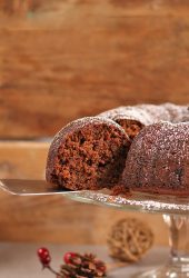 A slice being removed from a bundt cake