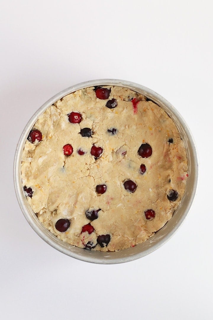 Scone dough pressed into a round cake pan