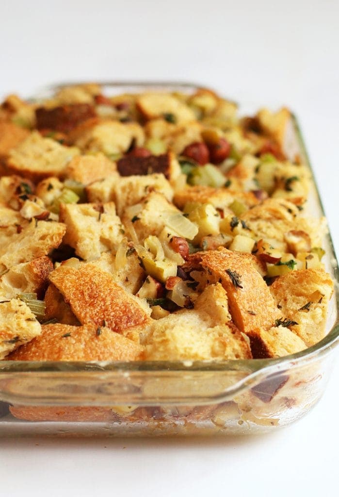 Vegan stuffing in a glass casserole dish.