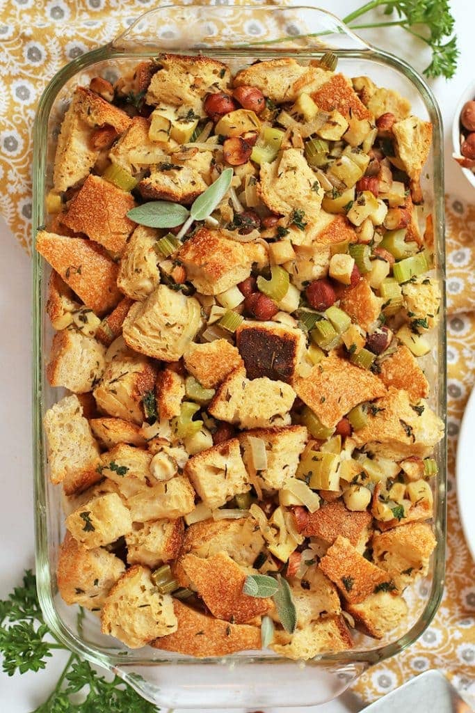 Vegan stuffing in a glass casserole dish.