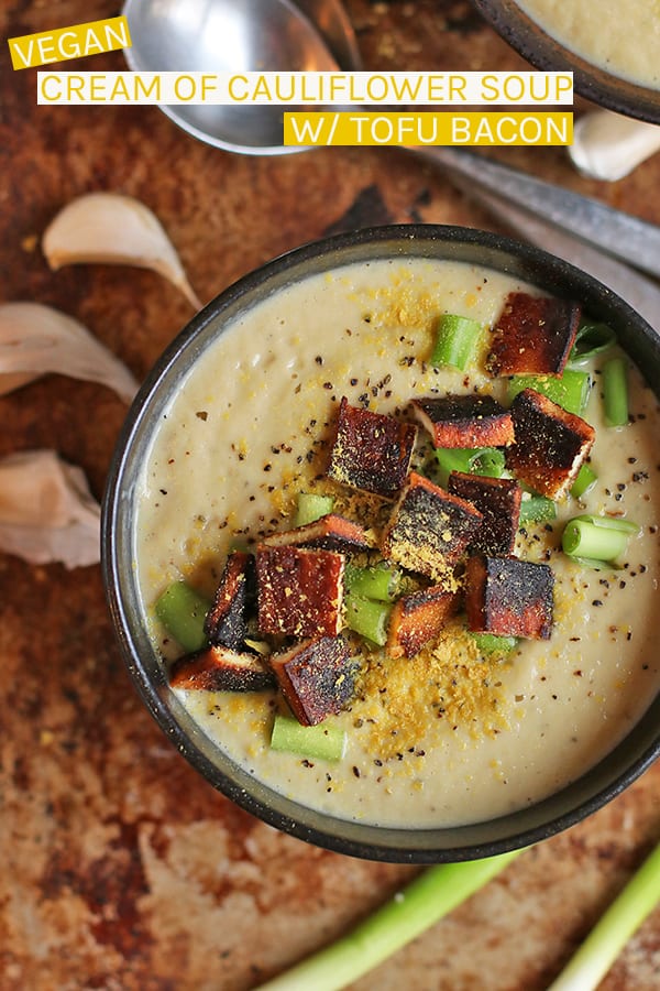 This Vegan Cream of Cauliflower Soup is made rich with cashew cream and nutritional yeast then topped with tofu bacon for a delicious gluten-free soup. #vegan #vegetarian #cauliflower #soup #fallrecipes #christmas #vegansoup #veganchristmas #mydarlingvegan