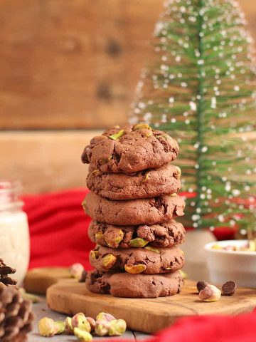 Stack of finished cookies on a wooden board.