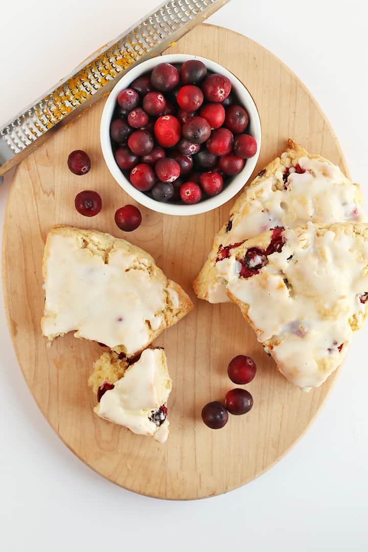 Finished scones on a wooden oval board. 