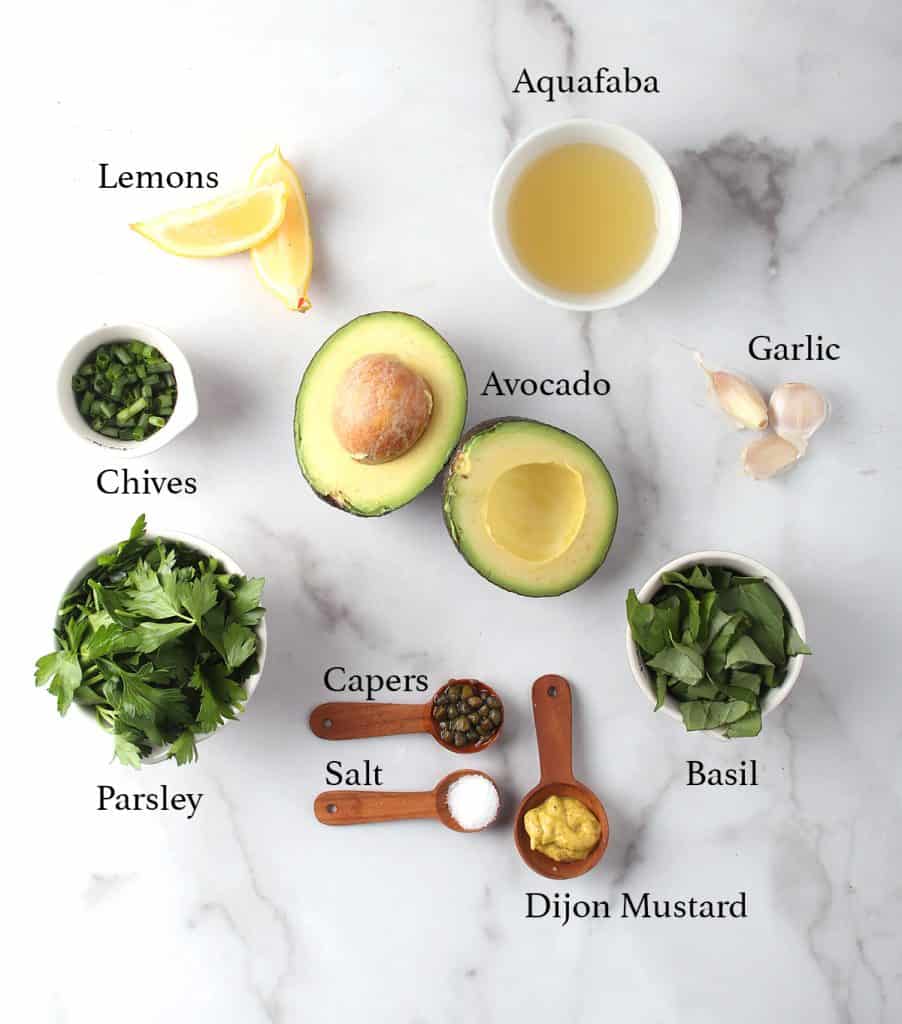 Ingredients for Green Goddess Dressing on a marble countertop 