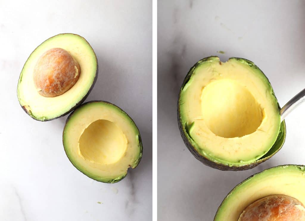 Halved avocado on a marble countertop