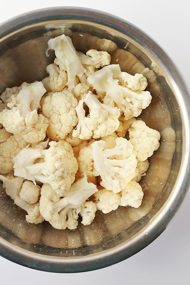 Cauliflower florets in a metal bowl