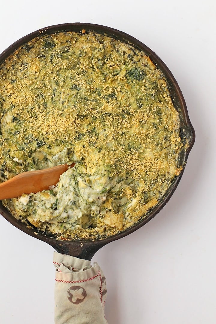 Vegan Spinach Artichoke Dip in a cast iron skillet