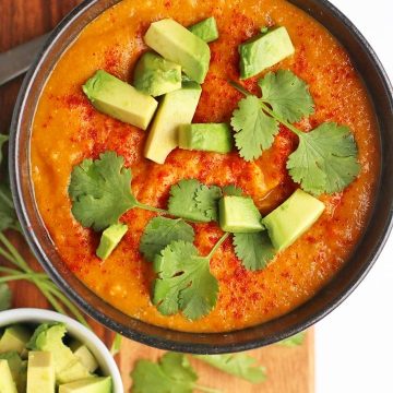 Bowl of finished soup with cilantro and avocado