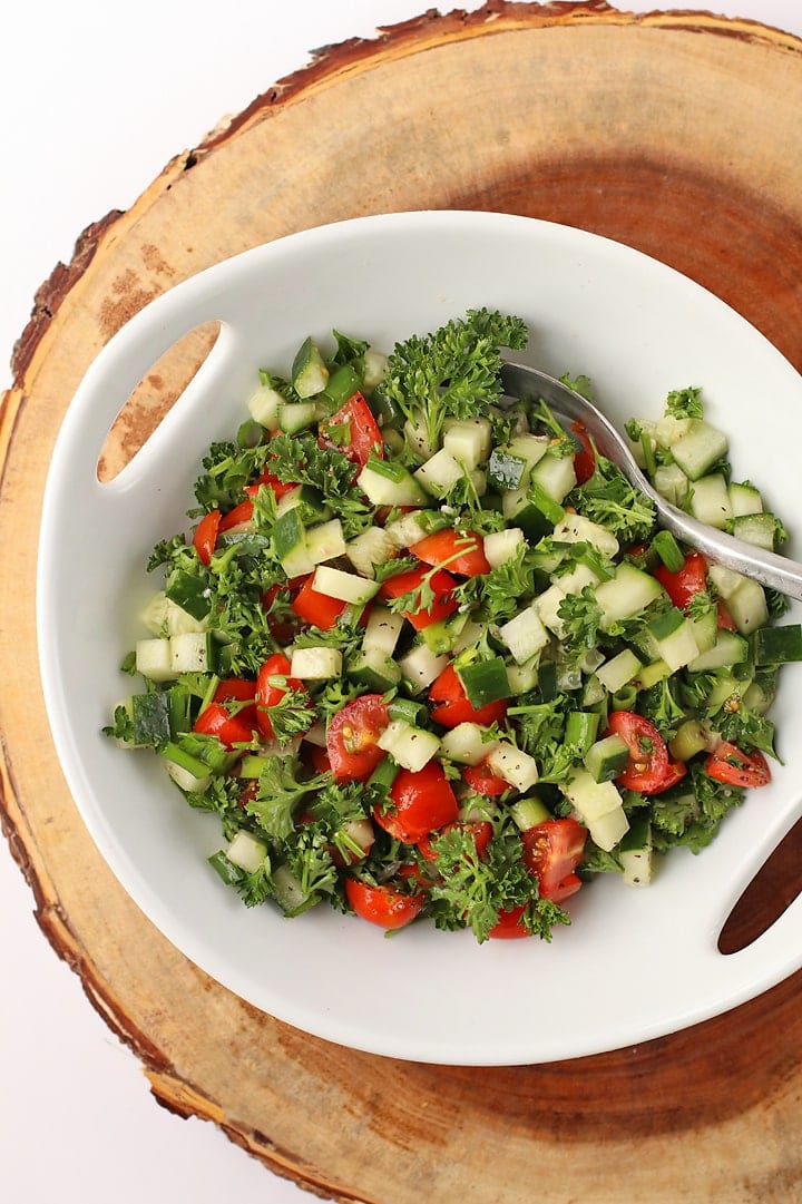 Cucumber Tomato Salad in a white bowl