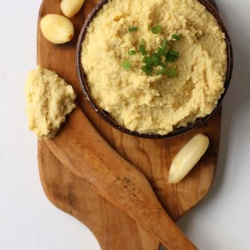 Vegan Cashew Ricotta in a small bowl on a wooden board