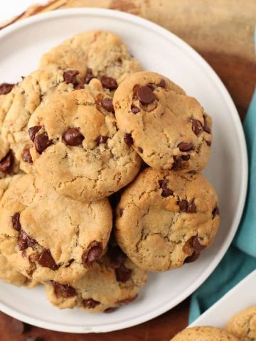 A white plate filled with Vegan Chocolate Chip Cookies