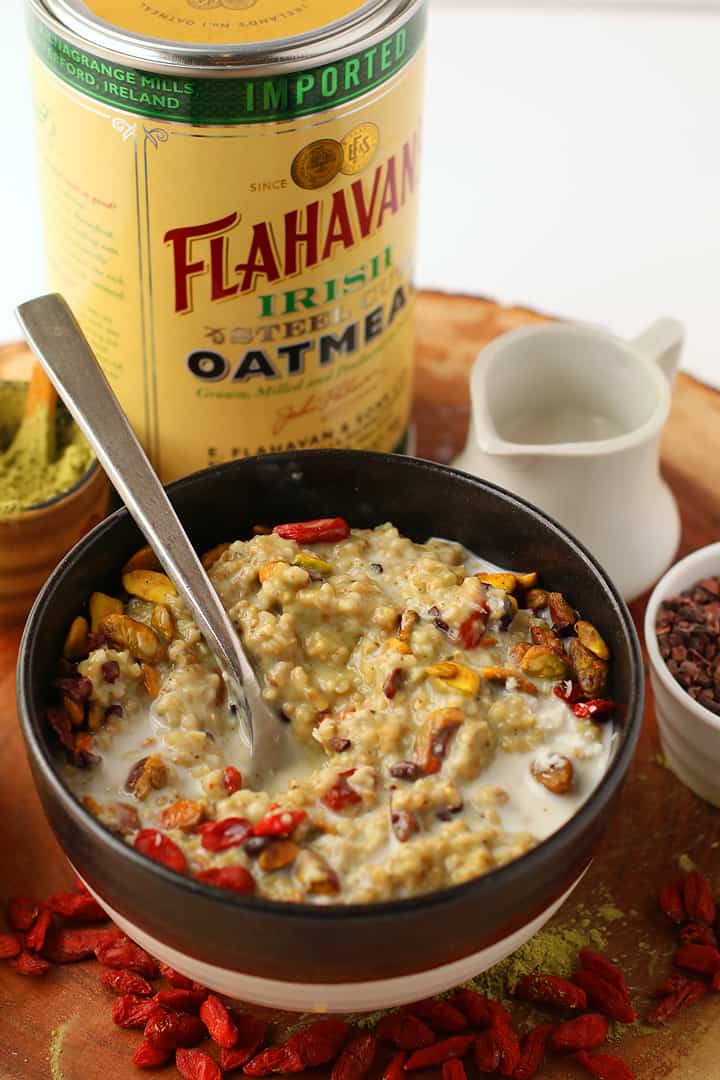 Matcha oatmeal in a bowl with a spoon