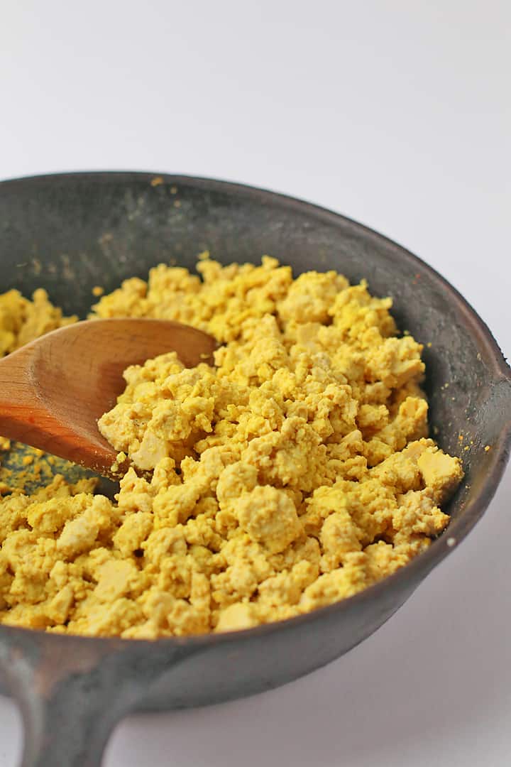 Tofu scrambled eggs in a cast iron skillet