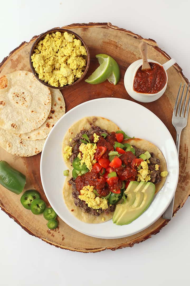 Vegan rancheros with salsa, avocado, and lime. 