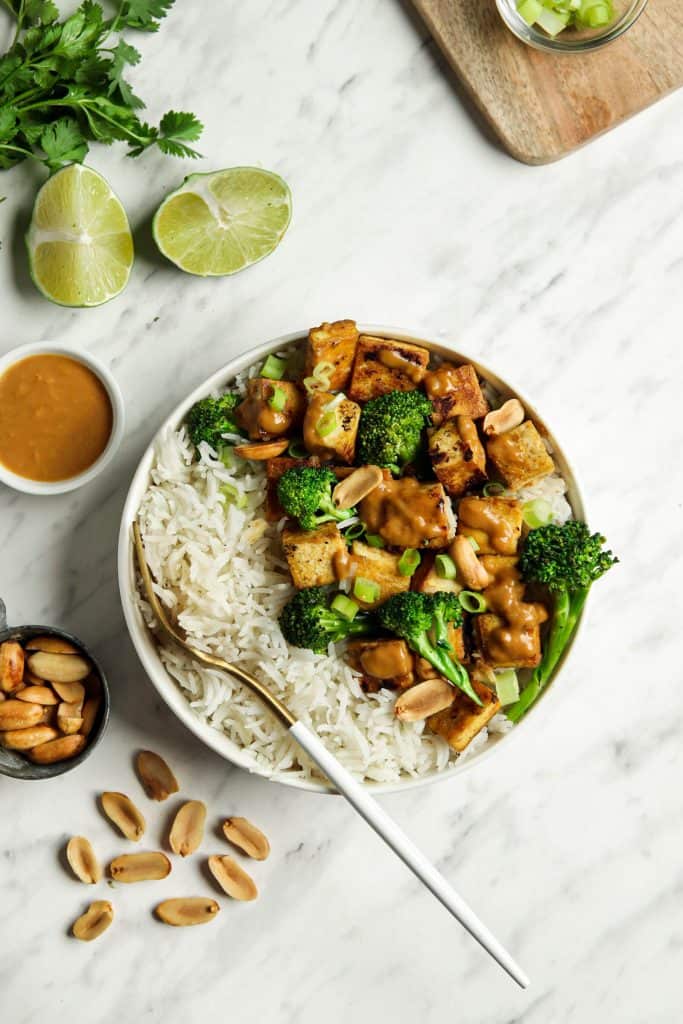 Bowl of peanut tofu with rice and broccolini 