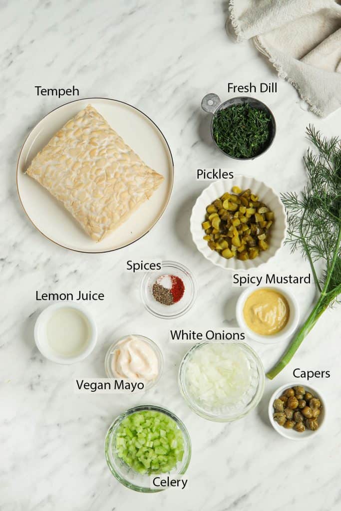 Ingredients for tuna tempeh salad measured out into small dishes