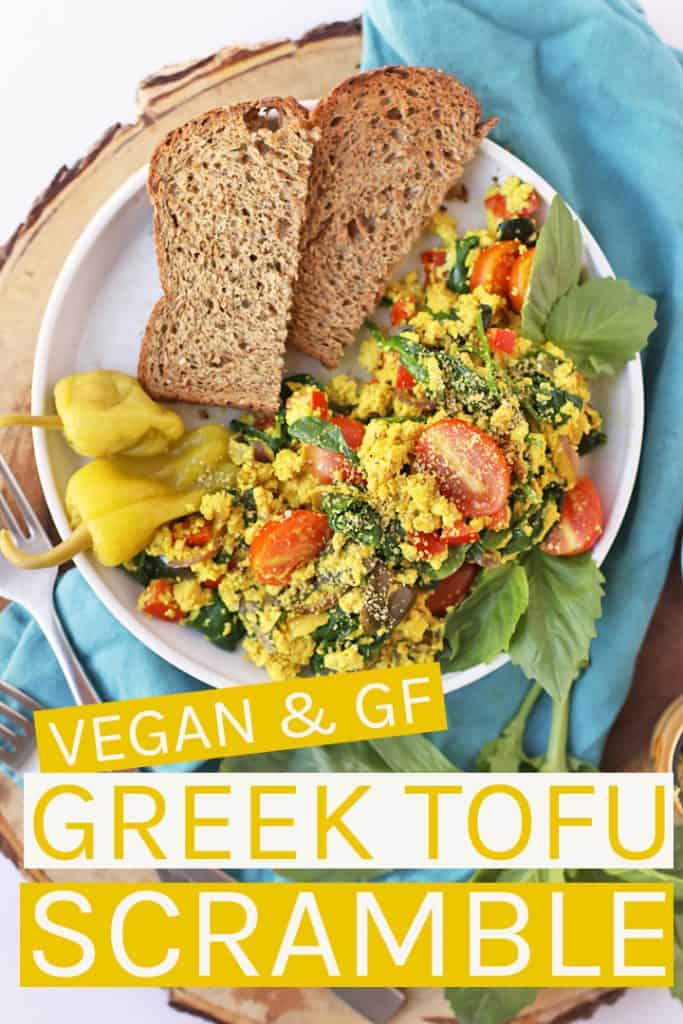 Start your day off right with this hearty and wholesome vegan Greek Tofu Scramble. It is made with seasoned tofu, olives, spinach, and fresh tomatoes for a delicious plant based and gluten free meal.