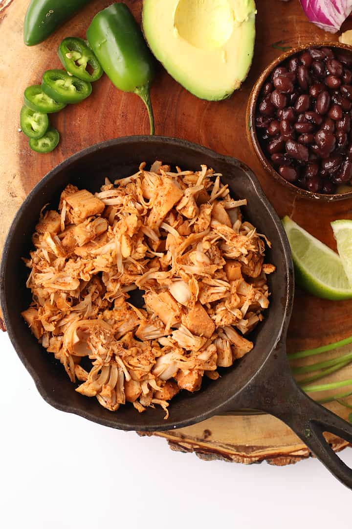 Seasoned and sautéed jackfruit in a cast iron skillet